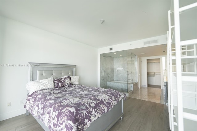 bedroom with wood-type flooring