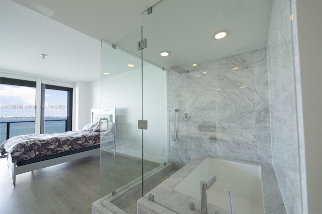 bathroom with a water view and walk in shower