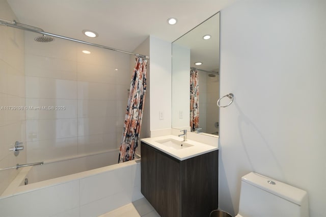 full bathroom with shower / tub combo, vanity, and toilet