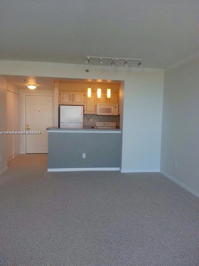 kitchen featuring crown molding, baseboards, carpet, decorative backsplash, and white appliances