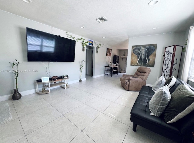 tiled living room with a textured ceiling