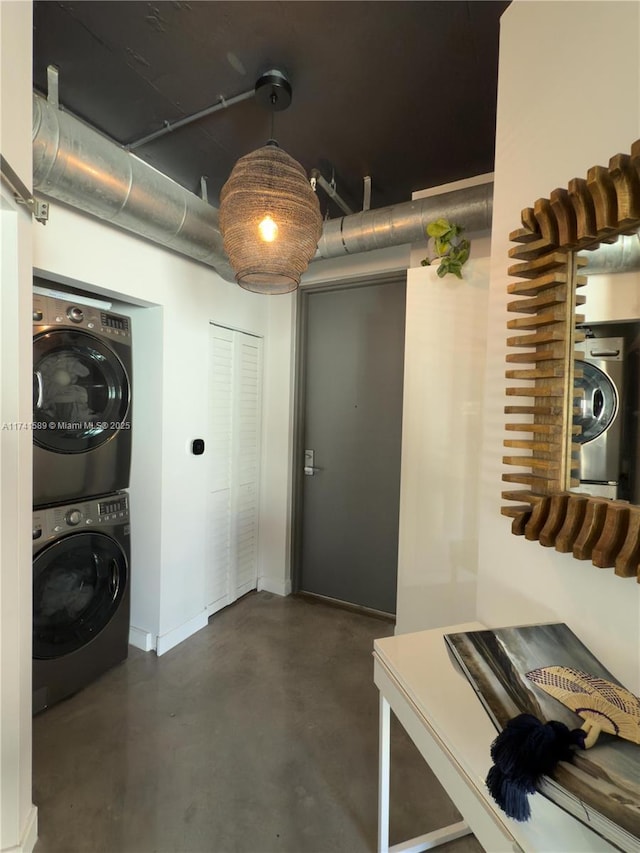 basement with stacked washing maching and dryer