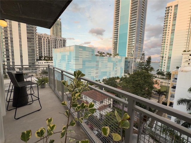 view of balcony at dusk