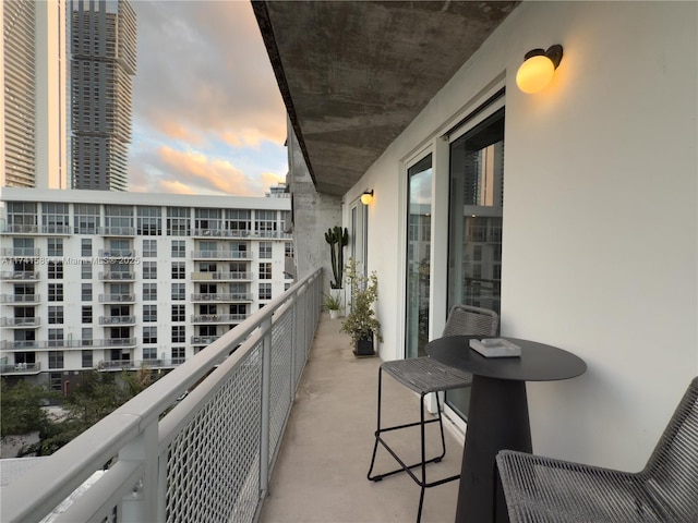 view of balcony at dusk