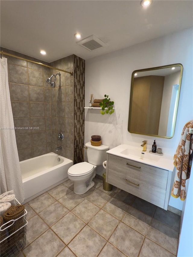 full bathroom with tile patterned floors, vanity, toilet, and shower / bath combo