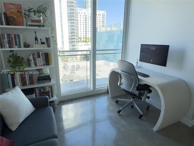 office space featuring concrete floors