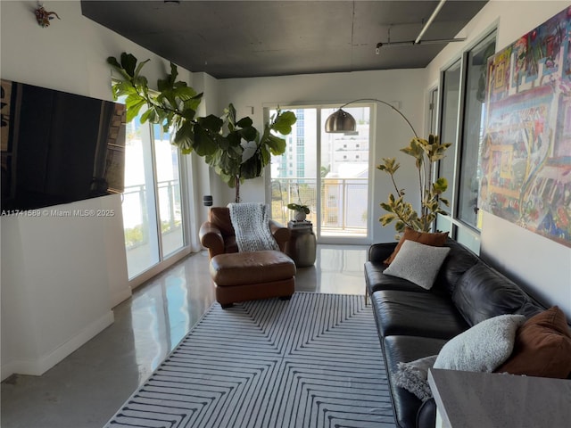 living room featuring concrete floors