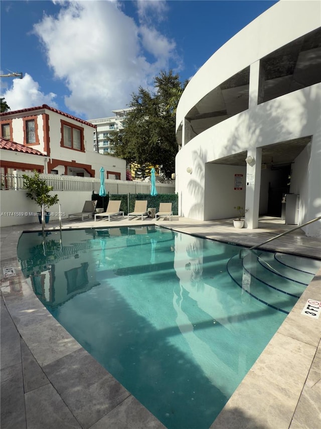 view of swimming pool with a patio area