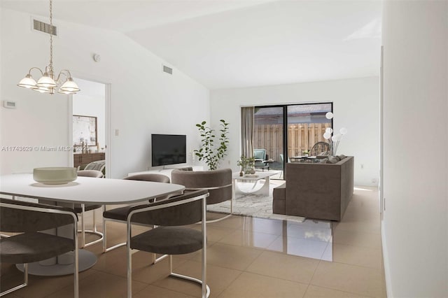 dining space featuring vaulted ceiling, an inviting chandelier, and tile patterned floors