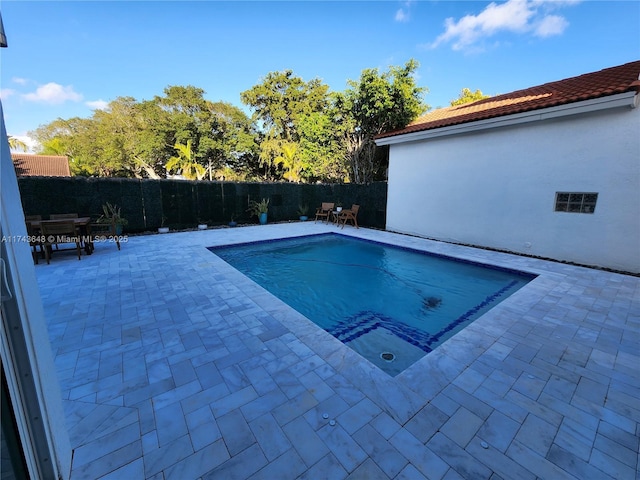 view of pool featuring a patio