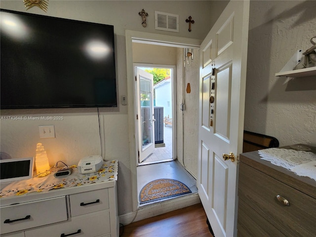 doorway with dark hardwood / wood-style flooring