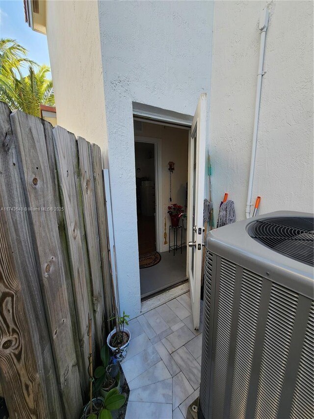 property entrance featuring central AC unit