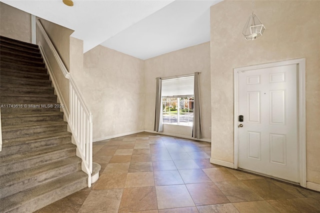 foyer featuring a high ceiling