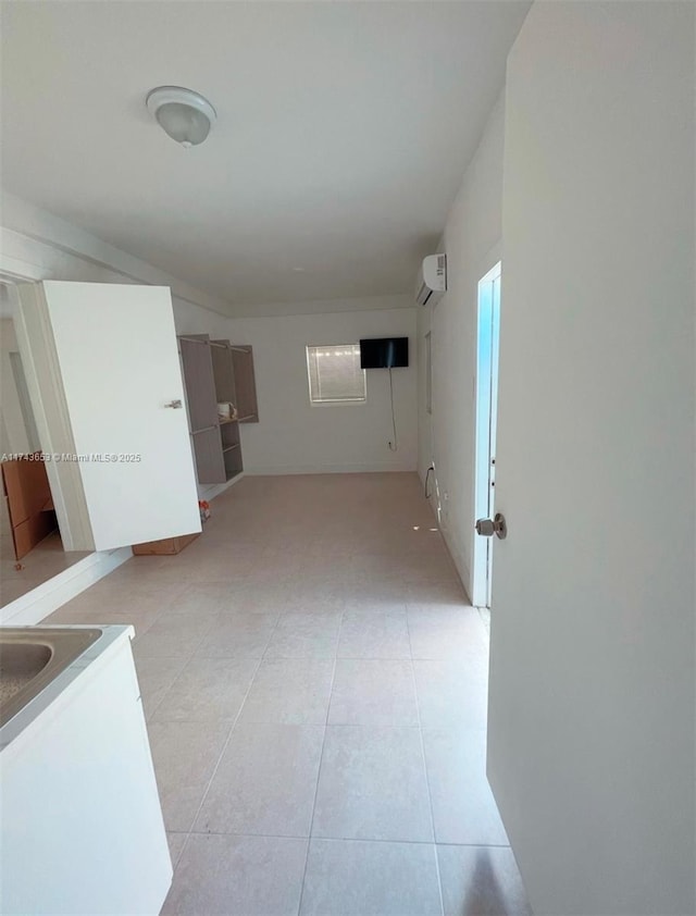 1431 NE 156th Ter, North Miami Beach, FL 33162 - hall with a wall unit AC and light tile patterned flooring