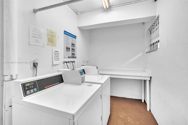 laundry room featuring washing machine and clothes dryer