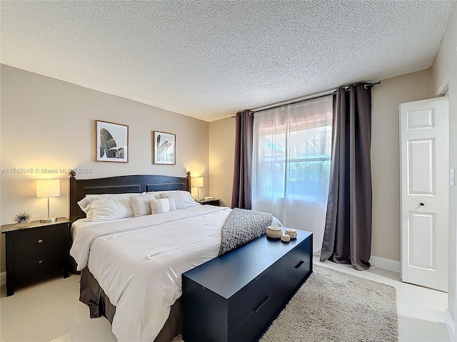 bedroom featuring a textured ceiling