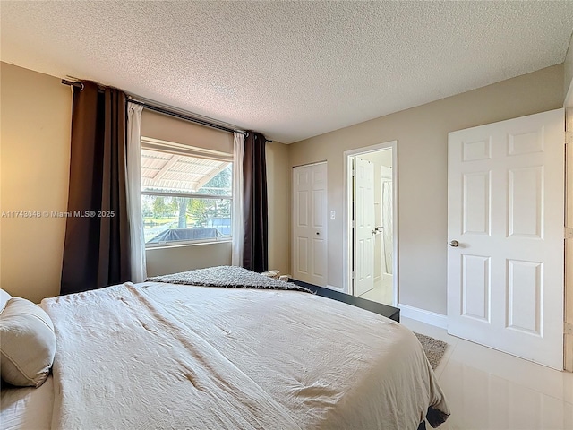 bedroom featuring a textured ceiling