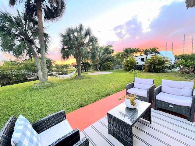 wooden deck with a yard, a patio, and outdoor lounge area