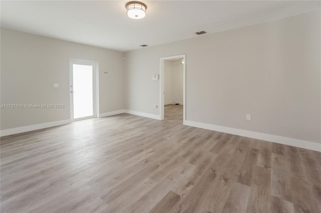 empty room with light wood-type flooring