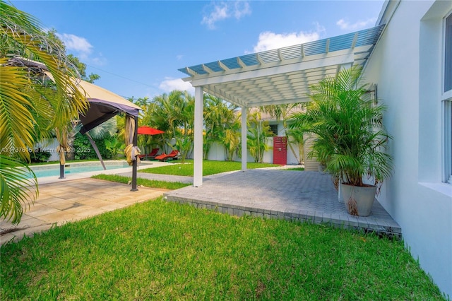 view of yard with a patio area and a pergola