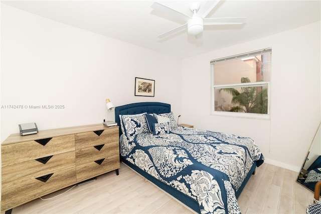 bedroom featuring ceiling fan and hardwood / wood-style floors