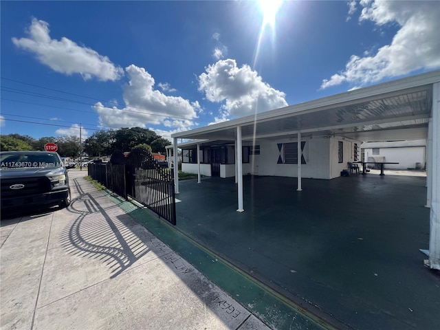 view of vehicle parking featuring a carport