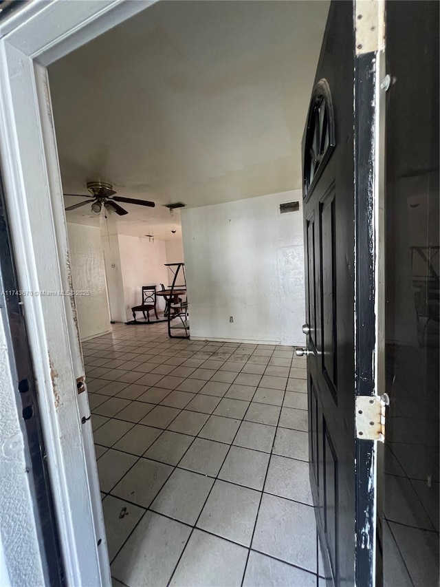 interior space featuring ceiling fan