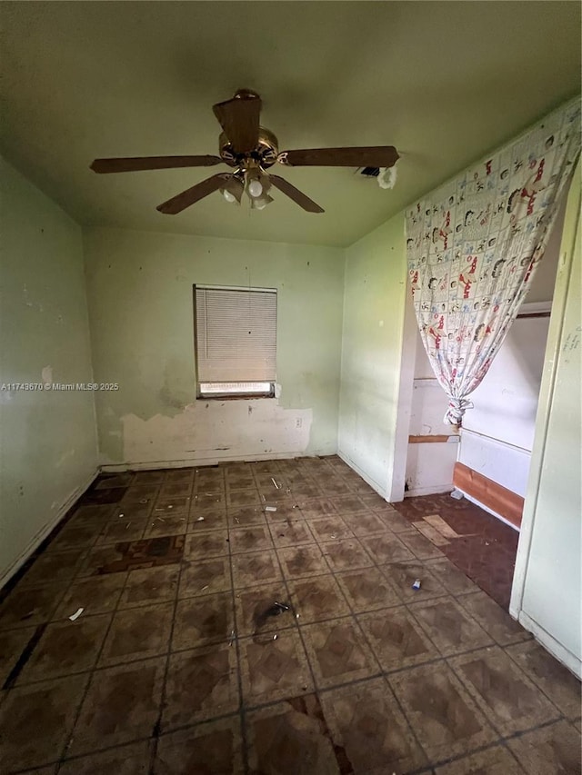 spare room with ceiling fan