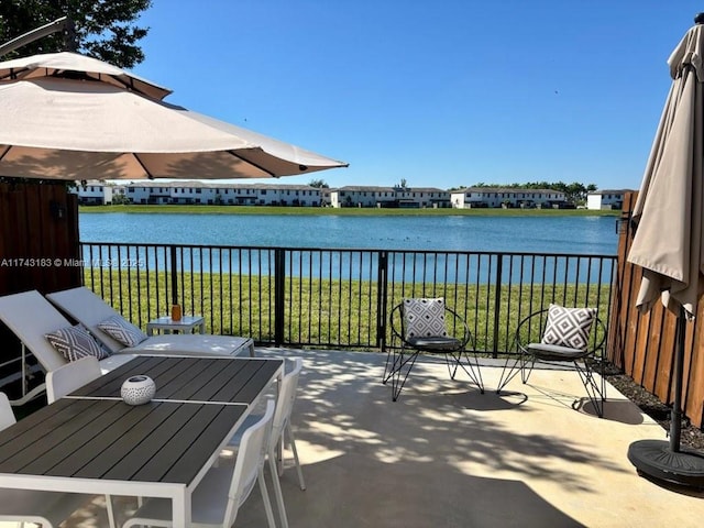 view of patio featuring a water view