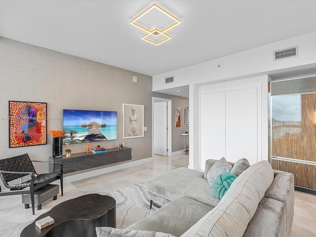 living area featuring visible vents