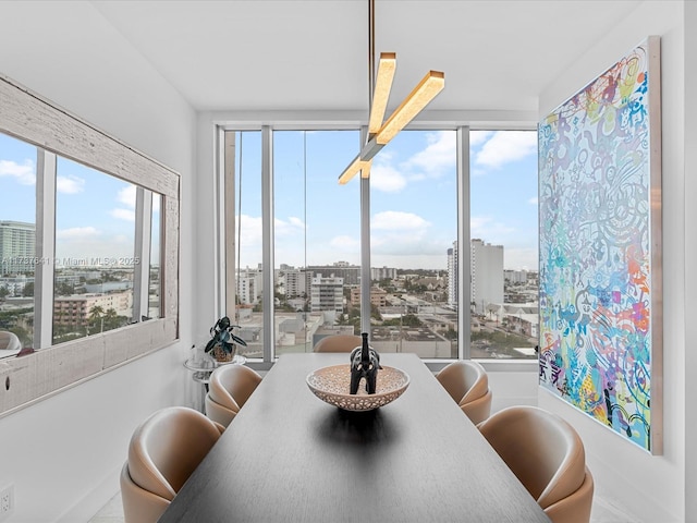 dining space with a city view and a healthy amount of sunlight