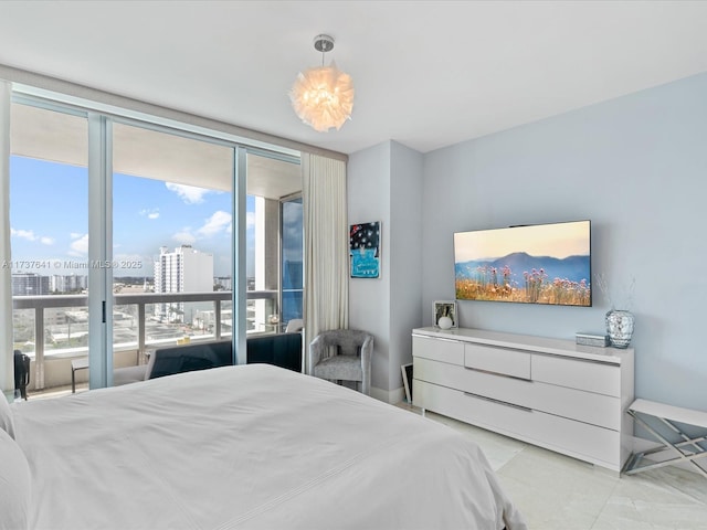 bedroom featuring light tile patterned floors and access to exterior