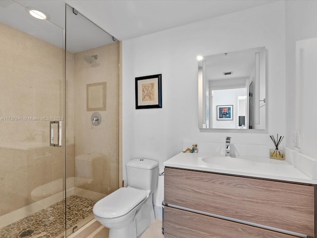 full bathroom with toilet, a stall shower, vanity, and visible vents