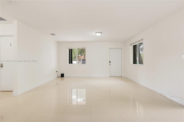 empty room featuring light tile patterned floors