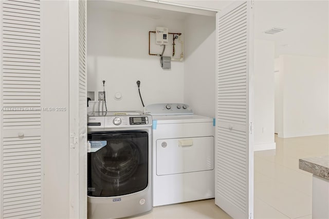 washroom with separate washer and dryer