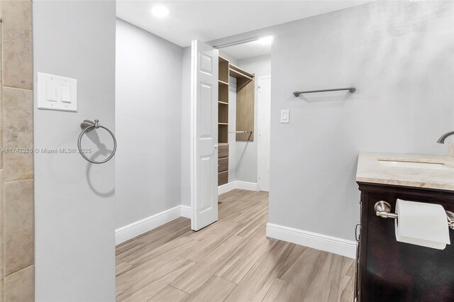 6911 Environ Blvd Unit 5L, Lauderhill, FL 33319 - bathroom featuring vanity and wood finished floors