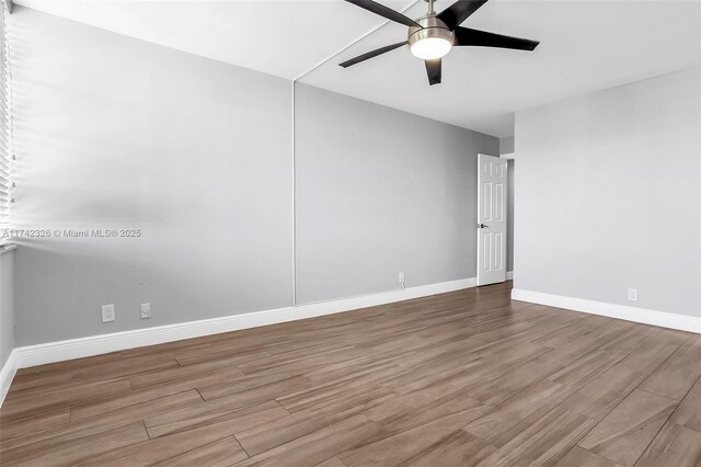 6911 Environ Blvd Unit 5L, Lauderhill, FL 33319 - unfurnished room with wood finished floors and a ceiling fan