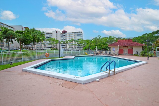 6911 Environ Blvd Unit 5L, Lauderhill, FL 33319 - community pool featuring a patio area