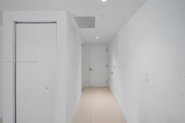 corridor with light tile patterned floors