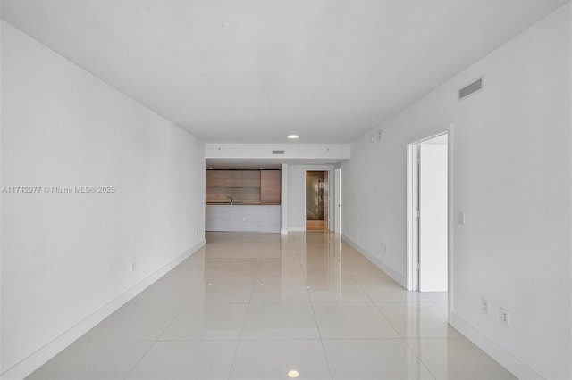 unfurnished room featuring light tile patterned floors