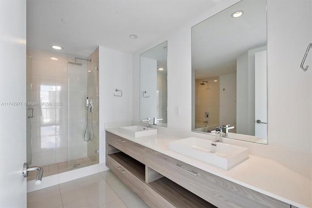 bathroom with vanity, tile patterned flooring, and a shower with shower door