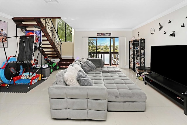 living room featuring tile patterned flooring and ornamental molding