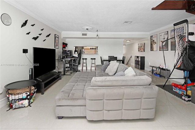 living room with crown molding and light tile patterned floors