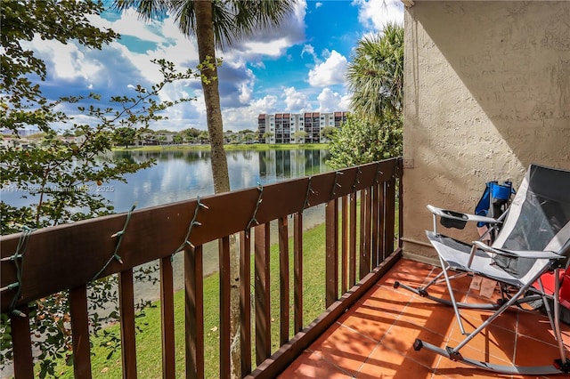 balcony featuring a water view