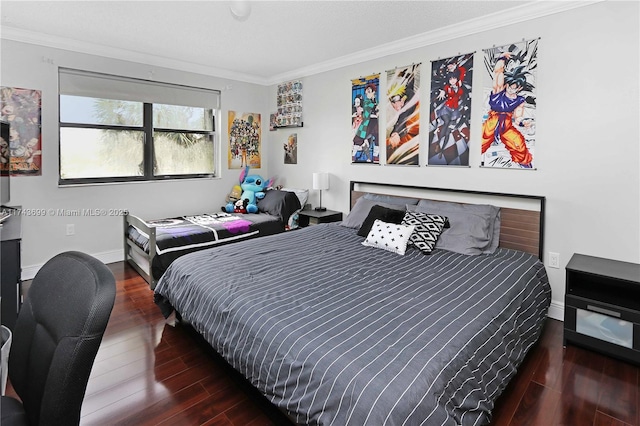 bedroom with dark hardwood / wood-style flooring and ornamental molding