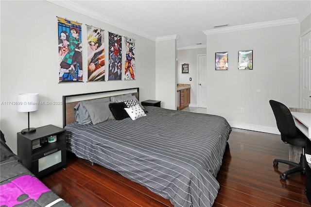 bedroom with dark wood-type flooring, ornamental molding, a textured ceiling, and ensuite bathroom