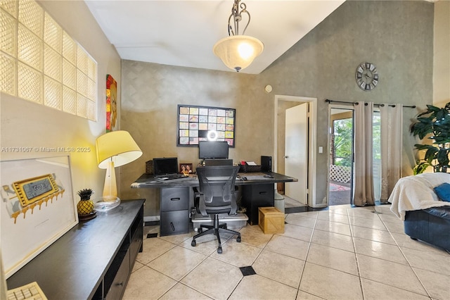 tiled home office featuring a towering ceiling