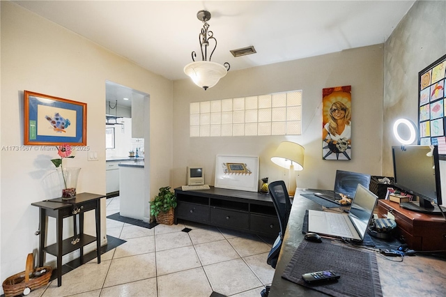 office area featuring light tile patterned flooring