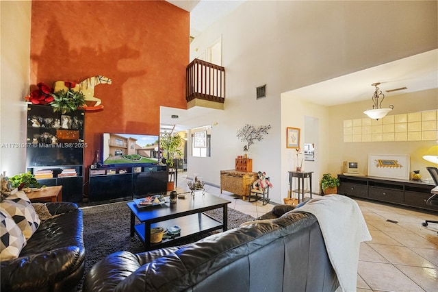 tiled living room with a high ceiling