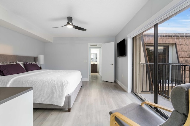 bedroom with access to exterior, a textured ceiling, and light hardwood / wood-style flooring